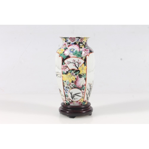 13 - Chinese Peranakan type porcelain vase, mid 20thC, affixed to wooden base, H16.3cm.