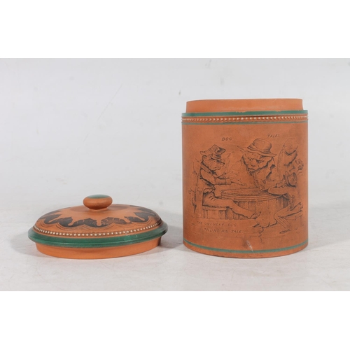 164 - Torquay style terracotta tobacco jar and cover decorated with 'The Unlucky Dog Telling His Tale' sce... 