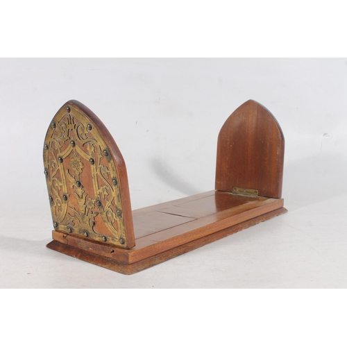 183 - Victorian style mahogany book slide, the lanceolate ends with brass fretwork and stud decoration.