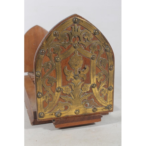 183 - Victorian style mahogany book slide, the lanceolate ends with brass fretwork and stud decoration.