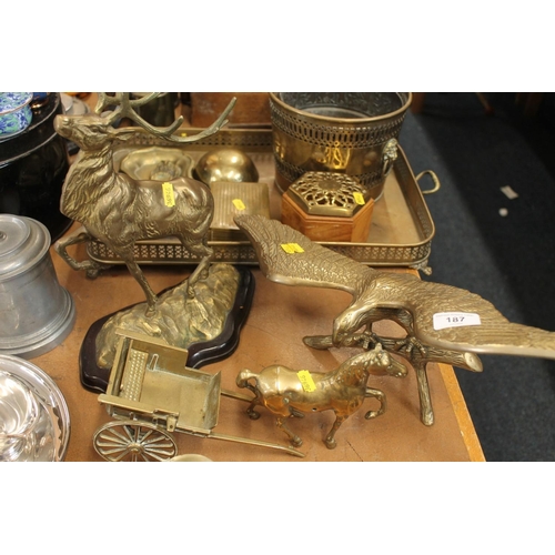 187 - Brass ornaments to include model of an eagle, horse and cart, Royal stag, etc. also a galleried tray... 