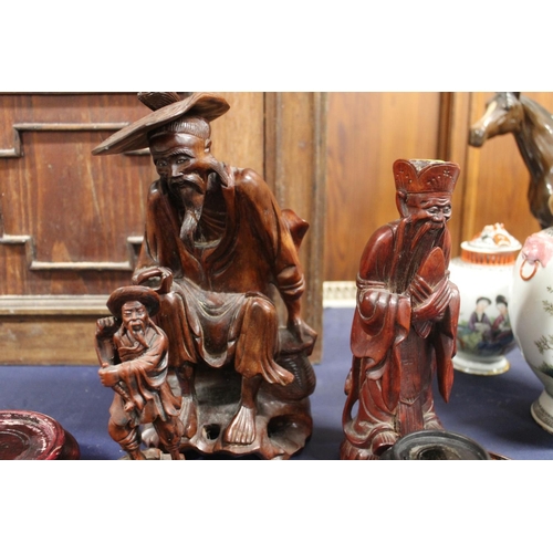 20 - Chinese carved hardwood figurines and selection of wooden vase bases, max H26cm