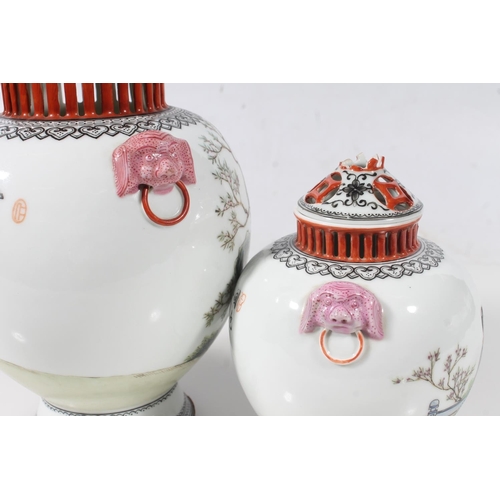 48 - Two Chinese porcelain early PROC period Famille Rose lidded vases, max H21cm.