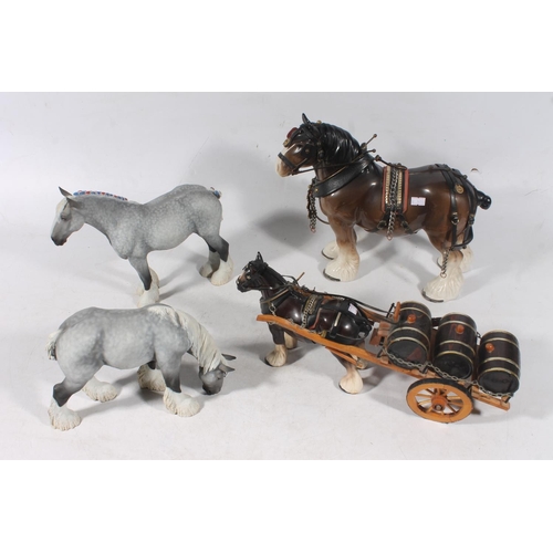 52 - Four draught horse figures.