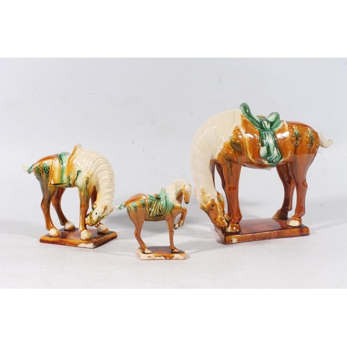 54 - Three Chinese Tang style pottery horses, max H24cm.