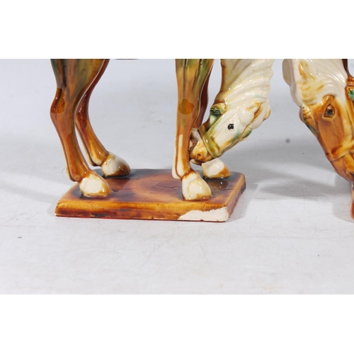 54 - Three Chinese Tang style pottery horses, max H24cm.