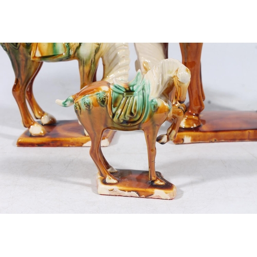 54 - Three Chinese Tang style pottery horses, max H24cm.