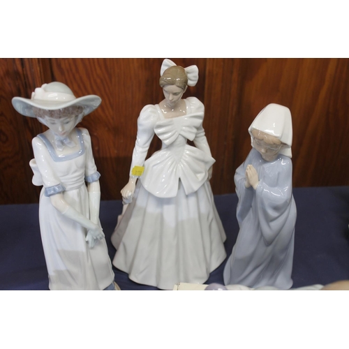 56 - Five Nao porcelain figurines together with a small Lladro baby figurine.