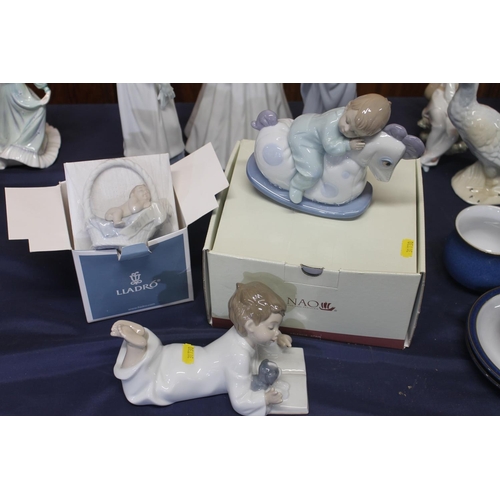 56 - Five Nao porcelain figurines together with a small Lladro baby figurine.