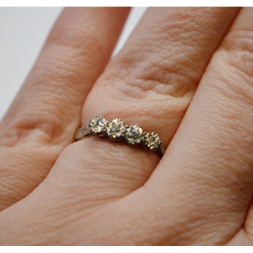 243 - 18ct gold diamond four-stone ring set with two brilliants to the centre, flanked by smaller brillian... 