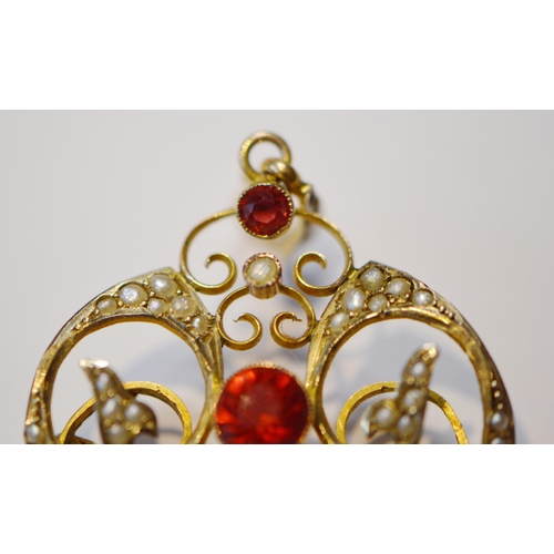 245 - Art Nouveau ruby and seed pearl lady's pendant with a central cabochon ruby, and smaller ruby above ... 