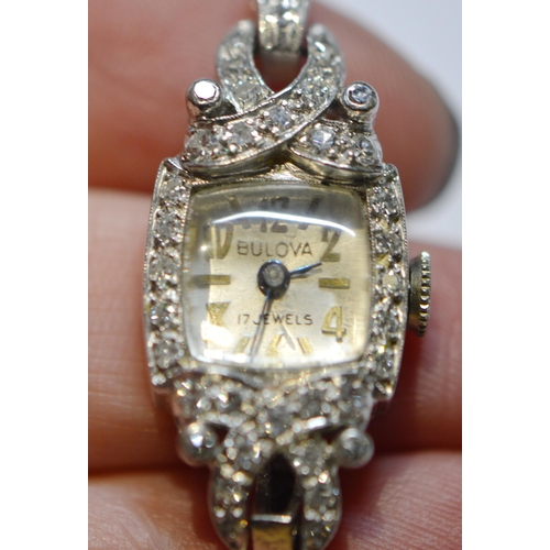 296 - Bulova 17 Jewels Art Deco-style platinum and diamond lady's cocktail watch, set with multiple small ... 