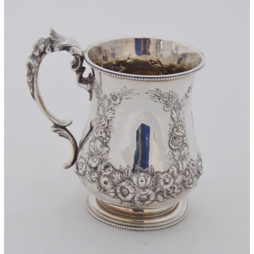 139 - Victorian silver tankard decorated with embossed foliate garlands, embossed scroll handle, by Daniel... 