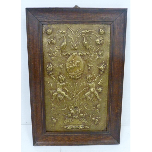 382 - Antique brass girandole plaque, possibly Dutch, 18th century, decorated with raised putti and floral... 