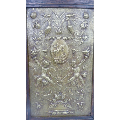 382 - Antique brass girandole plaque, possibly Dutch, 18th century, decorated with raised putti and floral... 