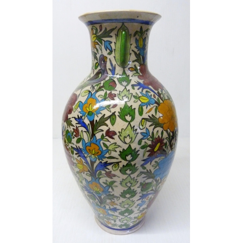 375 - Persian crackle glazed pottery vase of large baluster proportions, decorated with multi-coloured und... 