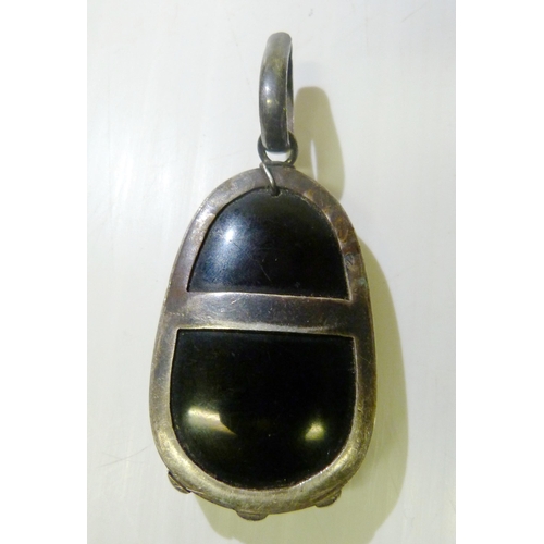 374 - South East Asian black obsidian pendant, carved with profile of the goddess Guanyin, mounted in whit... 