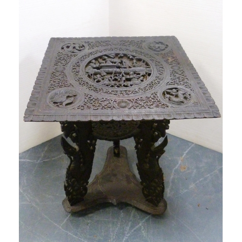 561 - Burmese carved hardwood table, c. early 20th century, the detachable square-shaped top with a centra... 