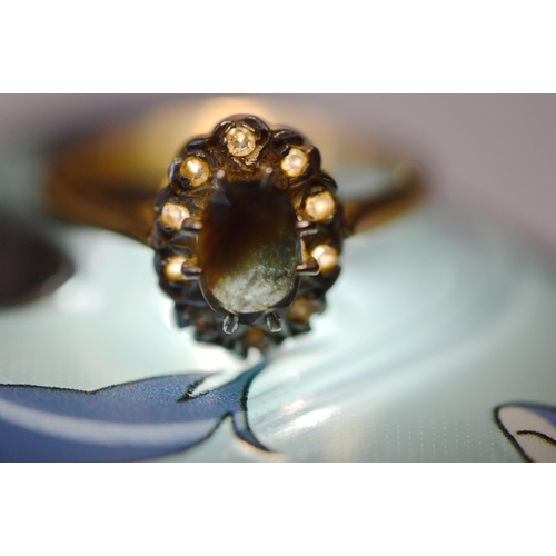 249 - 18ct gold sapphire and diamond lady's cluster ring, the oval sapphire flanked by small brilliants, s... 