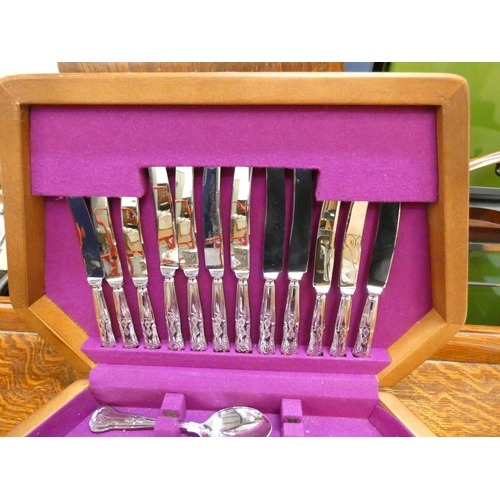 13 - Cased canteen of cutlery.