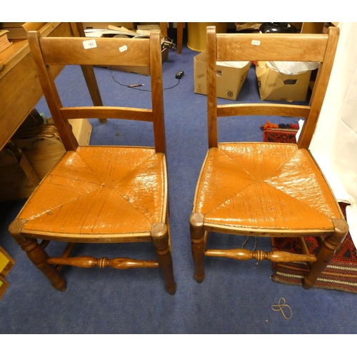 162 - Two rush seated country style dining chairs.