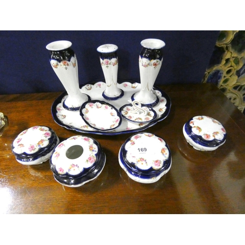 169 - Large blue and white floral porcelain vanity set.