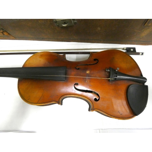 38 - Vintage half size violin and bow in leather case.