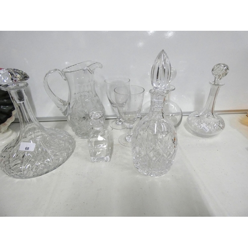 68 - Various crystal and glass decanters and jug.