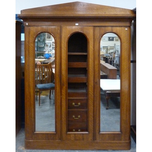 562 - Victorian mahogany wardrobe, the shaped cornice above two mirrored doors enclosing fitted drawers an... 