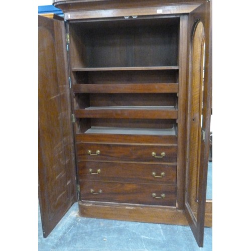 562 - Victorian mahogany wardrobe, the shaped cornice above two mirrored doors enclosing fitted drawers an... 