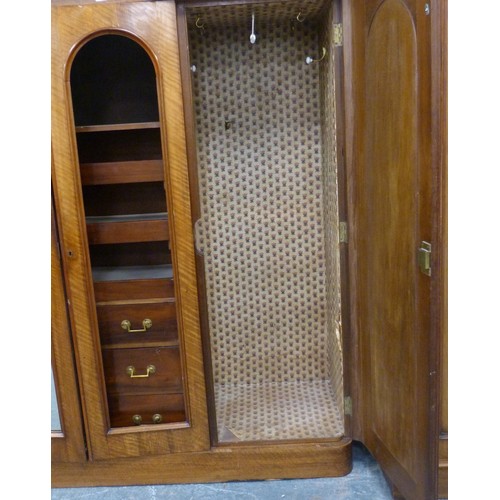 562 - Victorian mahogany wardrobe, the shaped cornice above two mirrored doors enclosing fitted drawers an... 