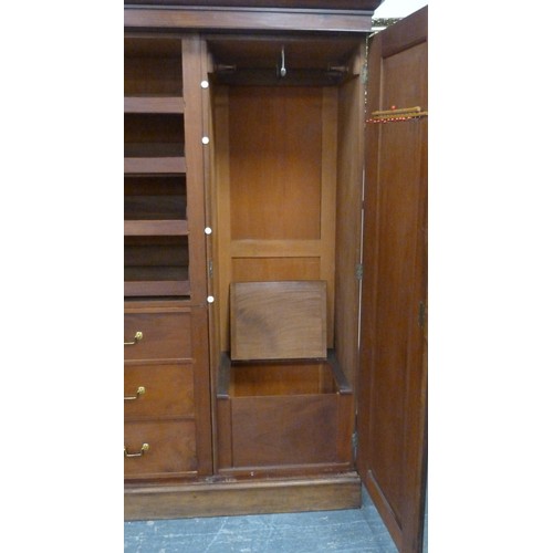 563 - Victorian mahogany three-door wardrobe, the moulded cornice above three doors, central pivot door, e... 