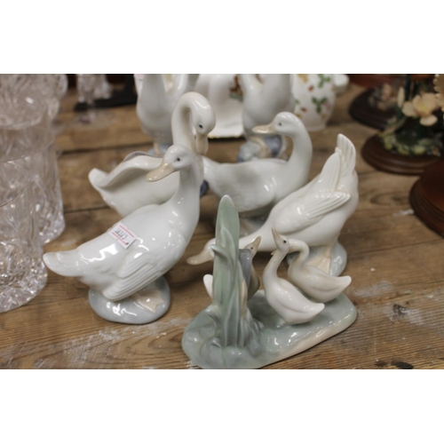 230 - Nao porcelain Swan and Geese figurines.