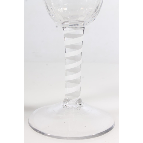 252 - Pair of early 20thC wine glasses with Lattimo ribbon twist stems, H18cm.