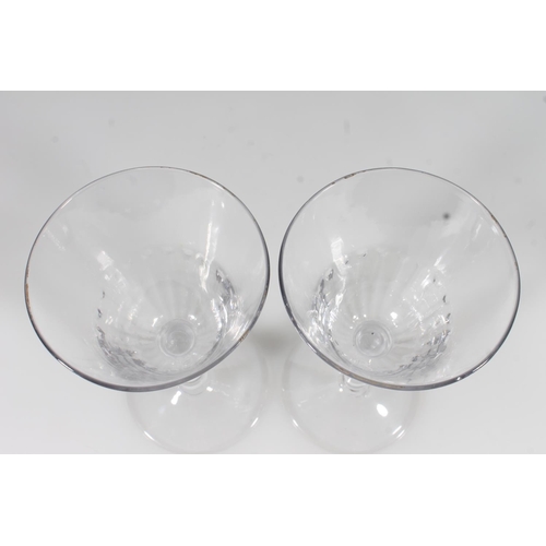 252 - Pair of early 20thC wine glasses with Lattimo ribbon twist stems, H18cm.