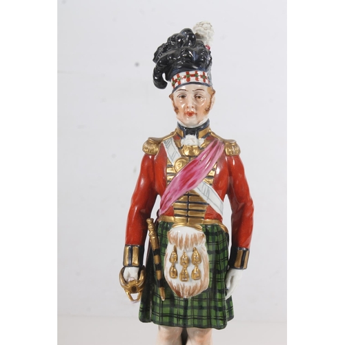 264 - Early 20thC German porcelain figurine of a Black Watch Guardsman, H27cm.