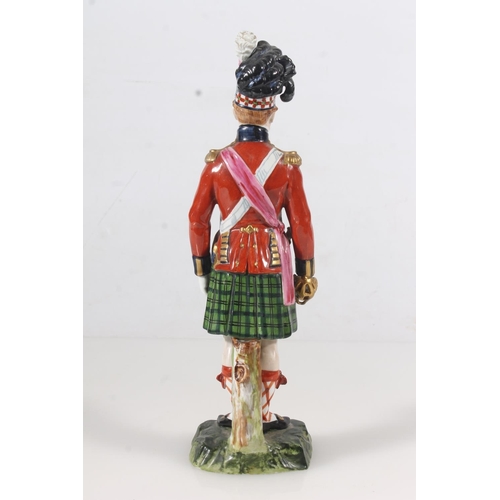 264 - Early 20thC German porcelain figurine of a Black Watch Guardsman, H27cm.