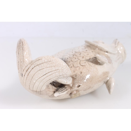 267 - Pottery model of a fish, L18cm.