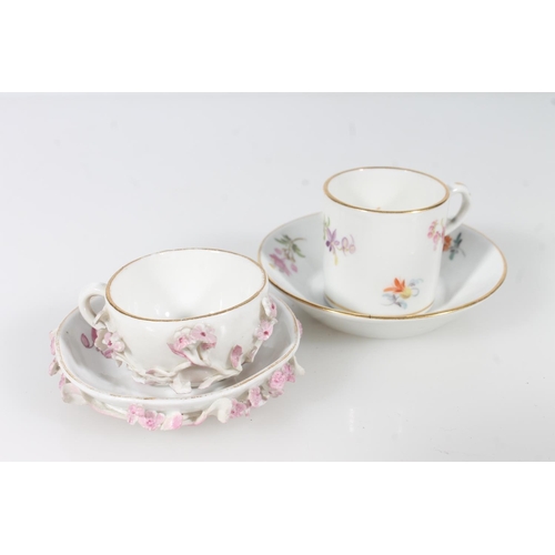 269 - Two miniature Meissen porcelain cups and saucers.