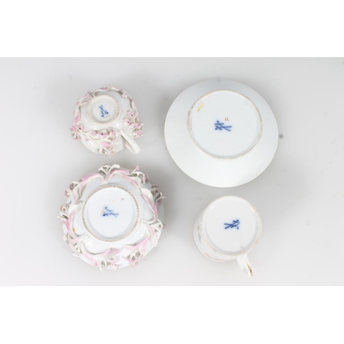 269 - Two miniature Meissen porcelain cups and saucers.