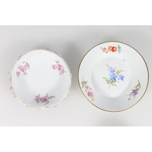 269 - Two miniature Meissen porcelain cups and saucers.