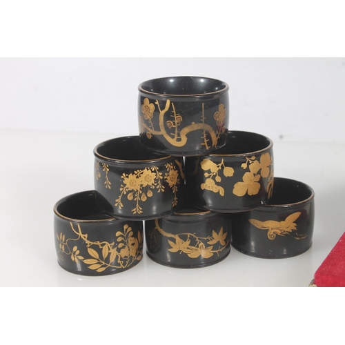 274 - Six Japanese black lacquer and gilt napkin rings together with a Great Wall of China souvenir medall... 