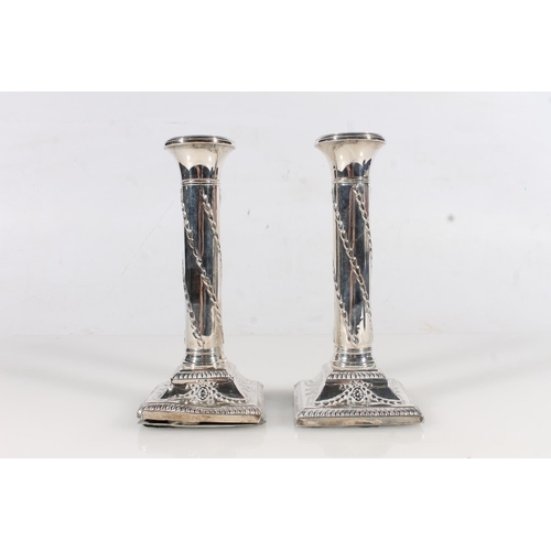 28 - Pair of Edw.VII weighted silver candlesticks, of classical column form, Henry Matthews Birmingham 19... 