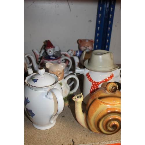 349 - Shelf containing novelty teapots, etc.