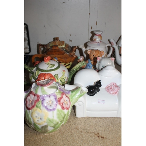 349 - Shelf containing novelty teapots, etc.