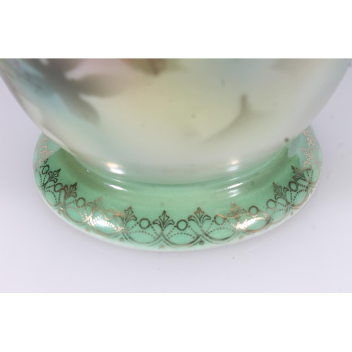 42 - Early 20thC German porcelain vase with transfer printed design of parrots on a green ground, H19.5cm... 