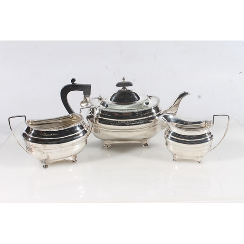 44 - Geo. V three piece silver tea service, the reeded rims over a ribbed body raised on bun feet, the te... 