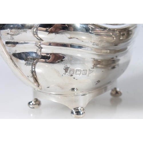 44 - Geo. V three piece silver tea service, the reeded rims over a ribbed body raised on bun feet, the te... 