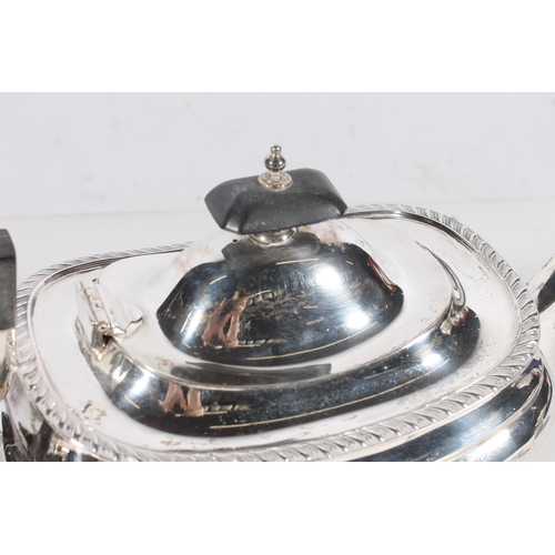 44 - Geo. V three piece silver tea service, the reeded rims over a ribbed body raised on bun feet, the te... 