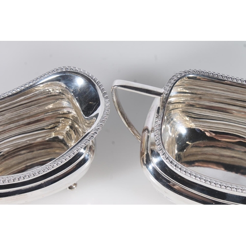 44 - Geo. V three piece silver tea service, the reeded rims over a ribbed body raised on bun feet, the te... 